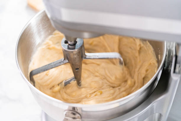 istock Mixing ingredients in kitchen mixer to bake banana nut bread. 1198227194