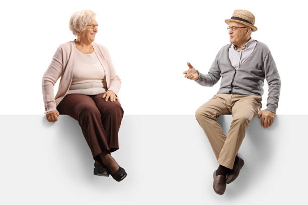 istock Senior people sitting on a panel and having a conversation 1198227203
