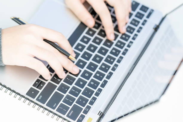 istock Woman working at home office using laptop searching web, browsing information 1198228091
