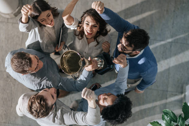istock Winning a trophy for business achievement! 1198228201