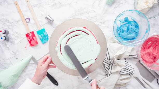 istock Frosting round three-layer vanilla cake with buttercream frosting. 1198228378
