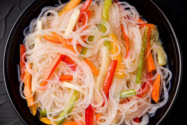 istock cooked noodles with vegetables close-up. 1198228422
