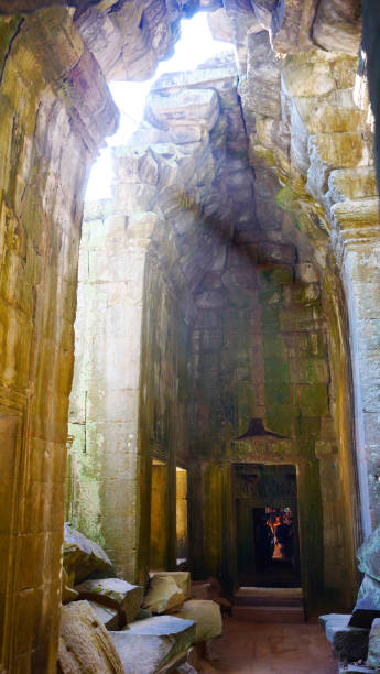 istock Holy sunlight at Ta Prohm Temple in Angkor wat complex, Siem Reap Cambodia. 1198228489