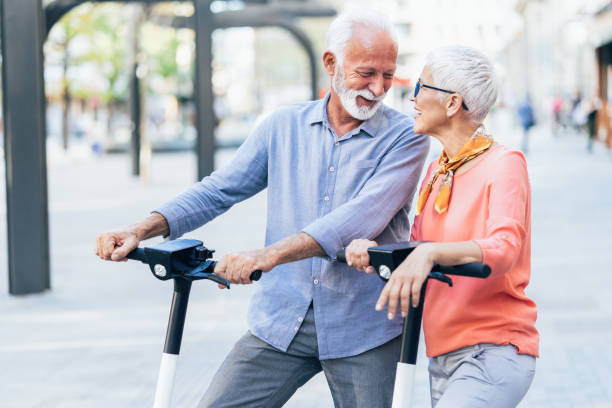 istock Modern senior couple with electric scooter 1198229294