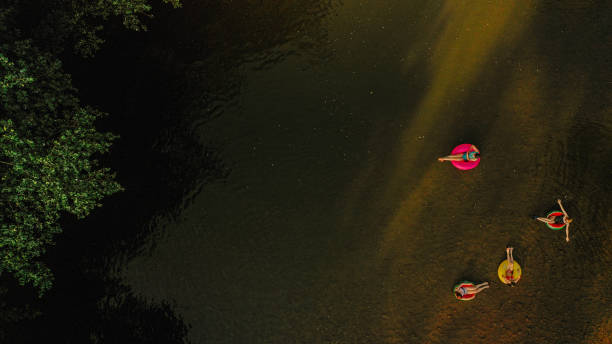 Photo of girlfriends on inflatable rings in the river