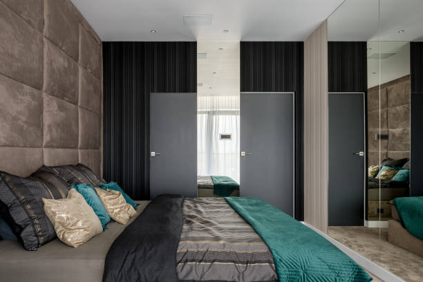 istock Bedroom with mirrored and upholstered walls 1198231990