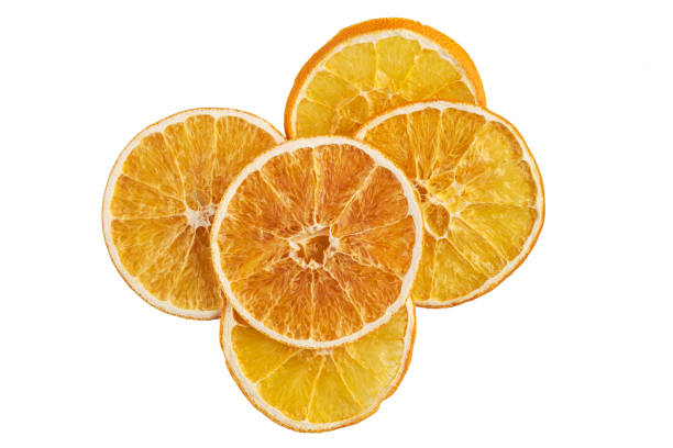 istock Stack of dried orange slices isolated on white 1198232064