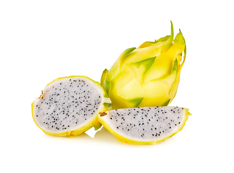 whole and half cut fresh dragon yellow shell fruit on white background