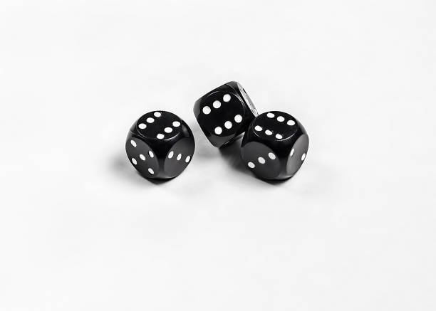 istock Dice on a white background. Three black dice. Gambling. 1198233536