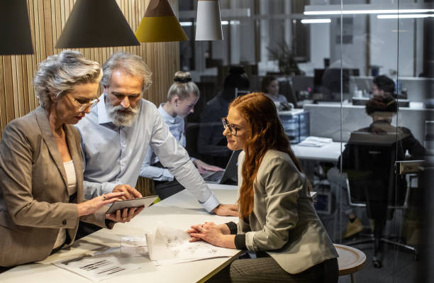 istock Business people working late in the office 1198234947