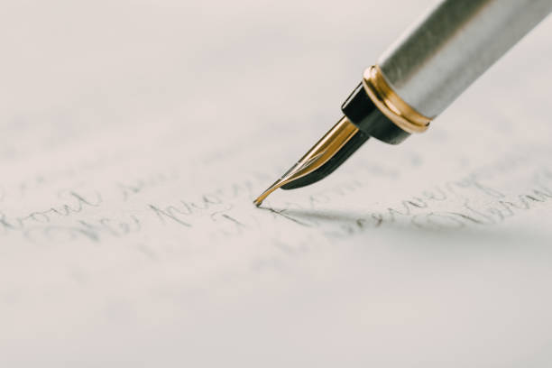 istock Fountain pen on an ancient handwritten letter. Old story. Retro style. 1198234964