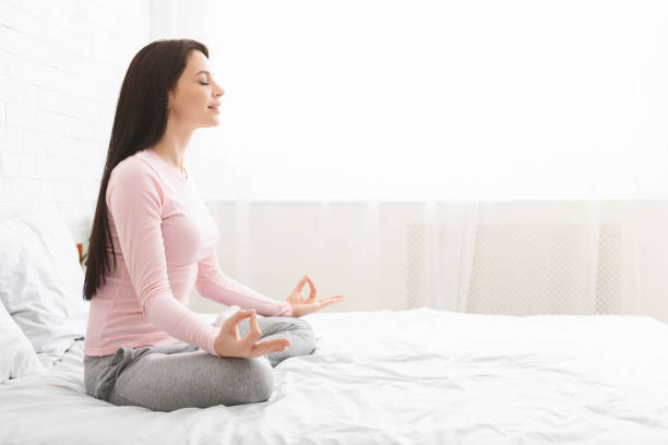 istock Calm woman practicing yoga at home, side view 1198234969
