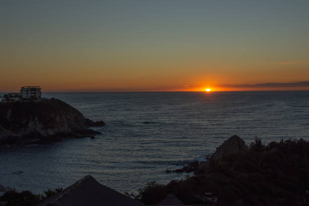 istock Sunrise over Pacific ocean in Huatulco, Mexico. 1198235834