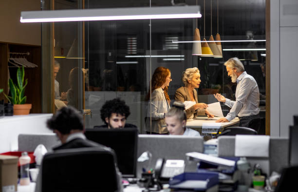 istock Business people working late in the office 1198236099
