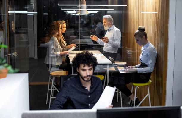 istock Business people working late in the office 1198236404