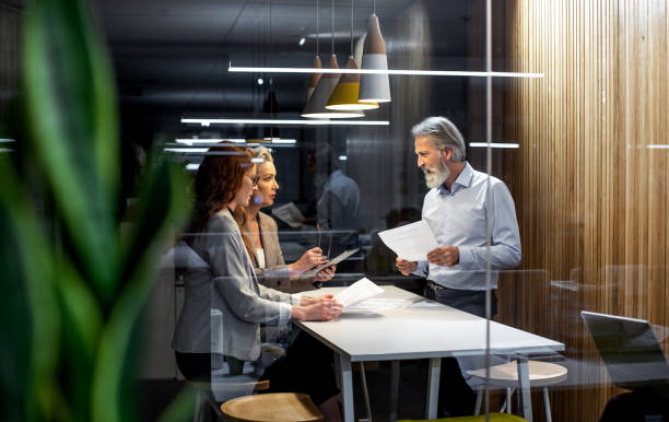 istock Business people working late in the office 1198236528