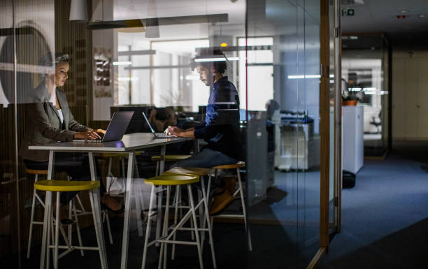 istock Business people working late in the office 1198236529