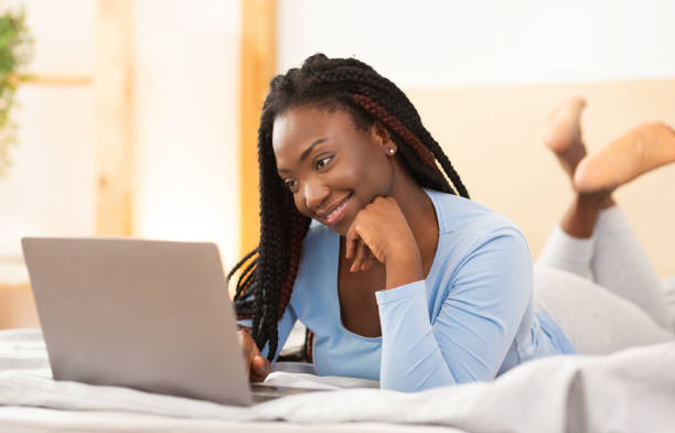 istock Student Girl Using Laptop Making Video Call Lying In Bedroom 1198236544