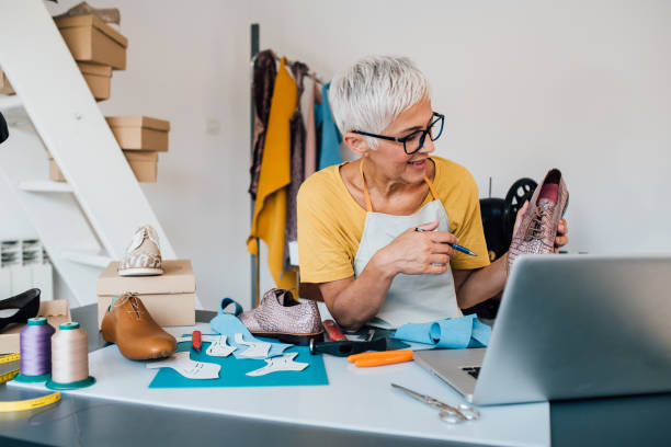 istock Shoemaker podcasting about her new products 1198237501