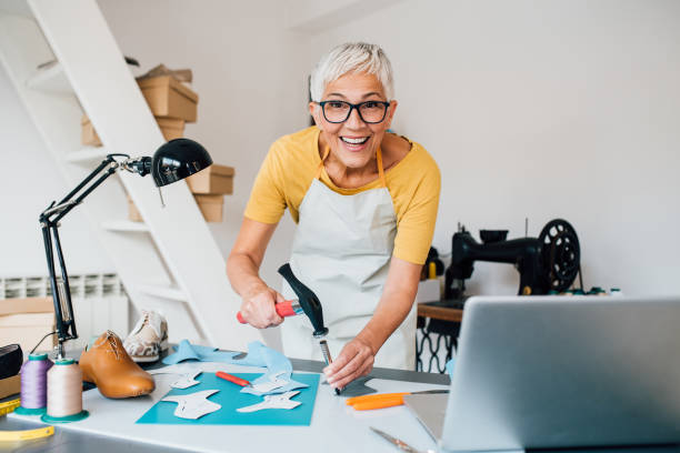 istock Mature woman making leather shoes at her workshop 1198237509