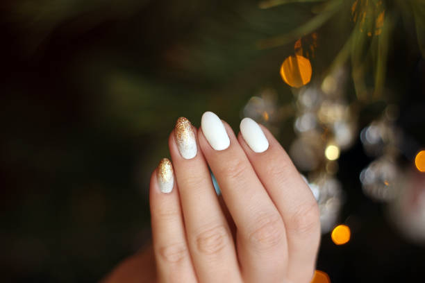 istock white nails with gold and silver glitter on a dark background, crystal, bokeh 1198237687