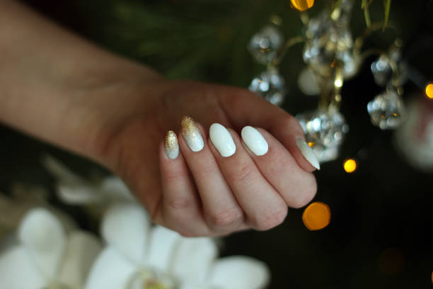 istock white nails with gold and silver glitter on a dark background, crystal, bokeh 1198237692