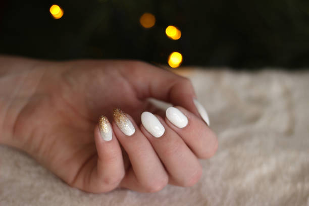 istock white nails with gold and silver glitter on a dark background, crystal, bokeh, fur 1198237705