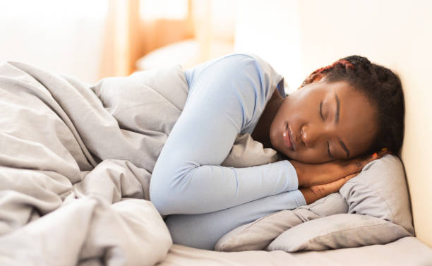 istock Woman Sleeping Taking Rest Lying In Cozy Bed In Bedroom 1198238641