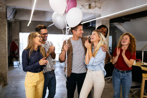 istock Colleagues celebrating a birthday in the office 1198238964