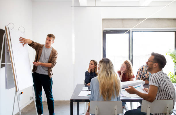 istock Business people designer architects teamwork brainstorming planning meeting concept 1198239283