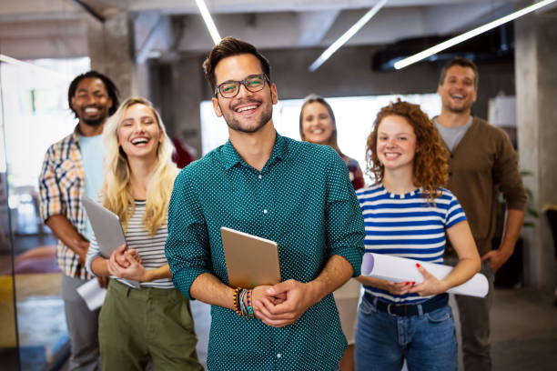 istock Creative brainstorming. Happy business people, designers, architects working as a team in office 1198240062