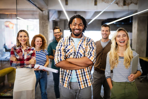 istock Successful company with happy employees in modern office 1198240081