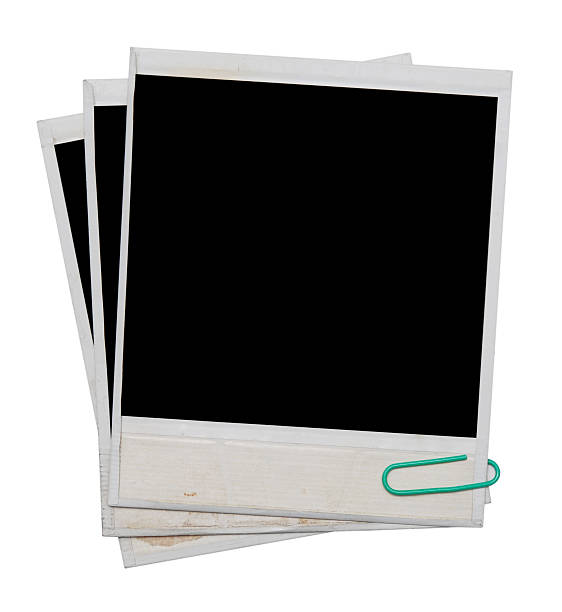 istock Three blank Polaroids paper clipped together 119824085