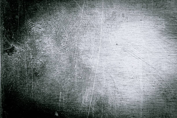 istock Scratched dirty dusty copper plate texture, black and white image. 1198241271