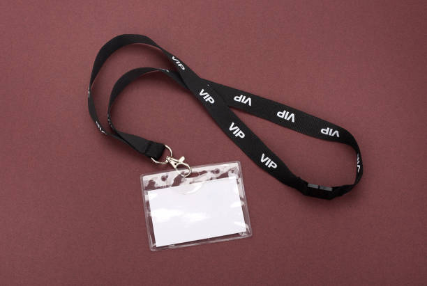 istock Blank VIP ID card isolated on colored paper background. 1198241653