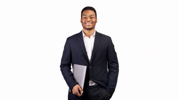 istock Handsome afro guy holding laptop on white background 1198242868