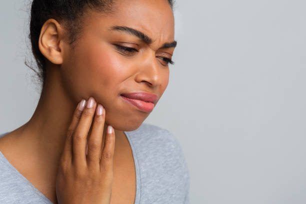 istock Exhausted afro girl suffering from strong pulpitis 1198243076