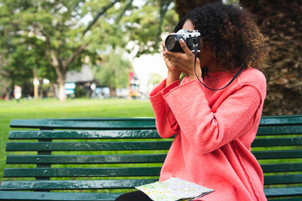 istock Afro-american woman looking at a map. 1198249107