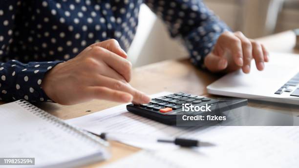 Woman Using Calculator Counting Finances Calculate Bills Pay Online Closeup Stock Photo - Download Image Now