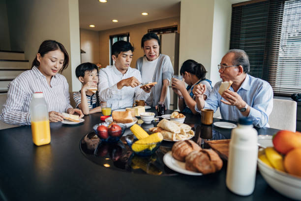 istock Big family having breakfast together at home 1198252762