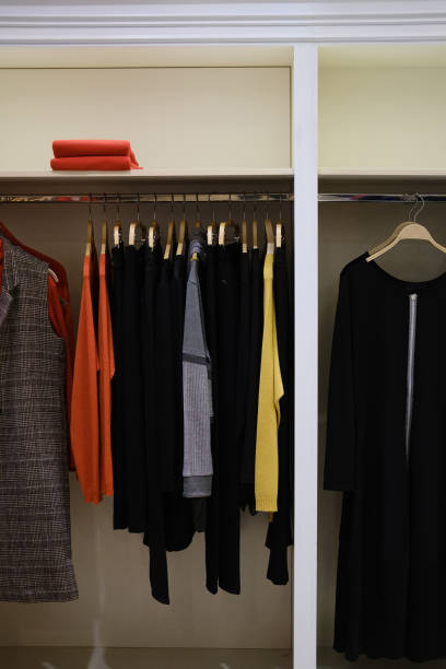 istock Wardrobe with stylish clothes hanging on rack. 1198254688