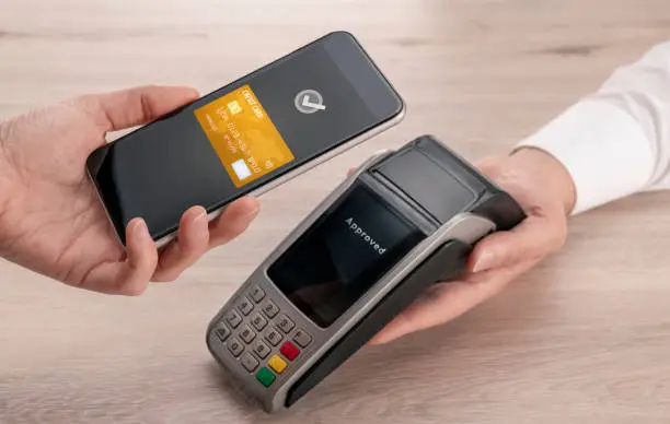 Photo of Contactless Payment with Smart Phone at the Point of Sale