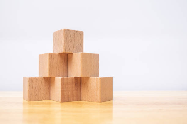 istock blank wood cube mock up in pyramid shape on isolated background for create letter or symbol, business, banner, advertising concept, banner size with copy space 1198258099