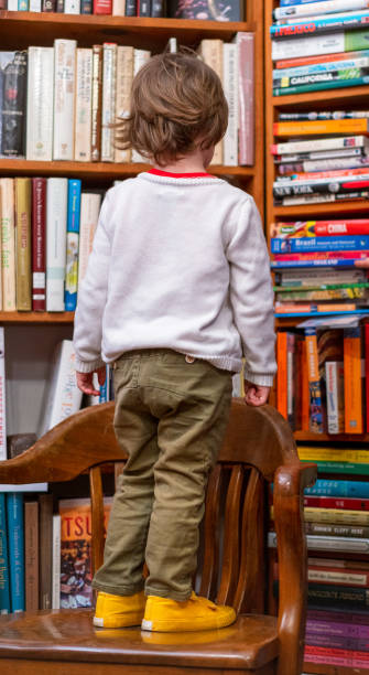 istock Stepping up to choose a book 1198258968