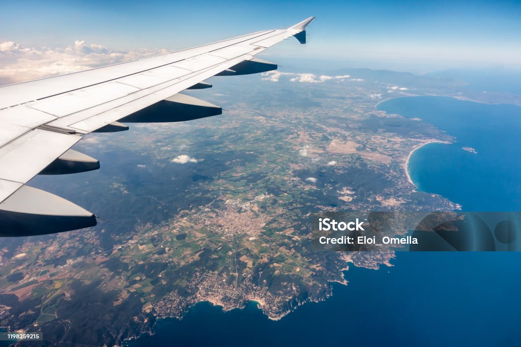 view of Costa Brava (Begur, Estartit, Roses, Cap de Creus) from an airplane. Catalonia, Spain. Airplane Stock Photo