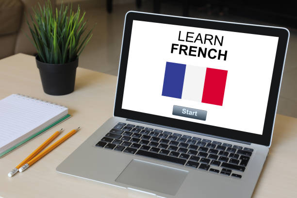 Learn French language online e-learning computer software laptop desk Learn French language online e-learning computer software laptop desk french language photos stock pictures, royalty-free photos & images