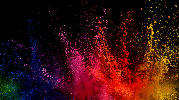 istock Explosion of colored powder isolated on black background 1198260319