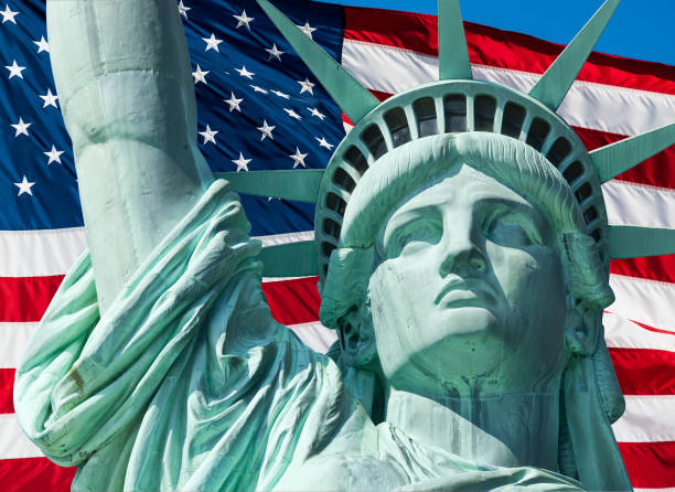 istock Statue of Liberty and US Flag 1198260392