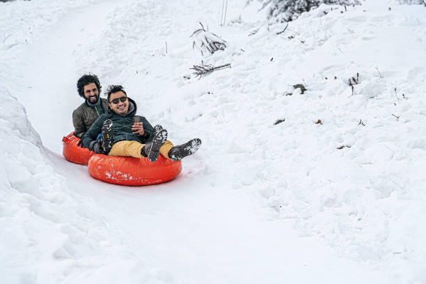 istock Sledding tubes on snowy hill in winter 1198260423