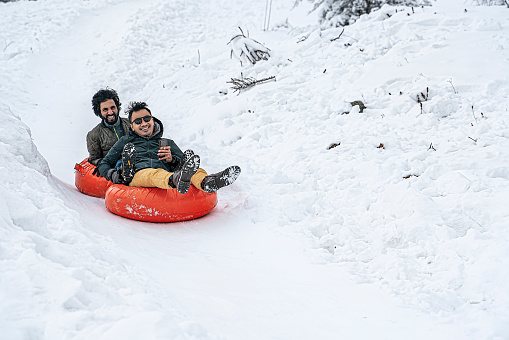 Sledding tubes on snowy hill in winter